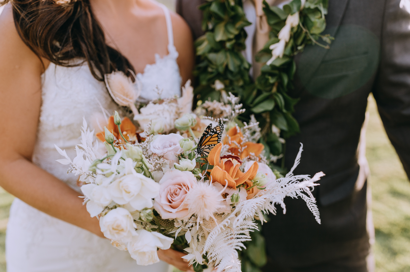 wedding couple released their live monarch butterfly and landed on the bride's bouquet 